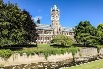 Otago University's historic architecture against a scenic backdrop, capturing the essence of academic tradition and natural beauty in New Zealand.