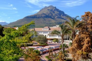 Scenic view of Stellenbosch University, South Africa, surrounded by lush landscapes and architectural beauty.