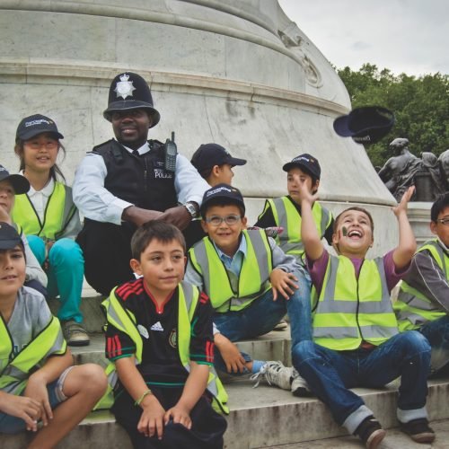 A picture of students from Frances King summer schools in London with police officer.