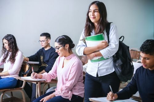 Diverse group of students engaged in language learning activities in language schools. Students are participating in interactive language classes, cultural exchange, and friendly discussions, creating a vibrant and inclusive learning environment.