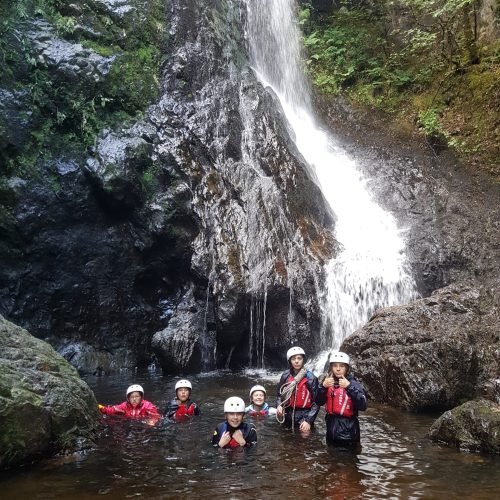 Myddelton summer schools in Liverpool students are at waterfall.