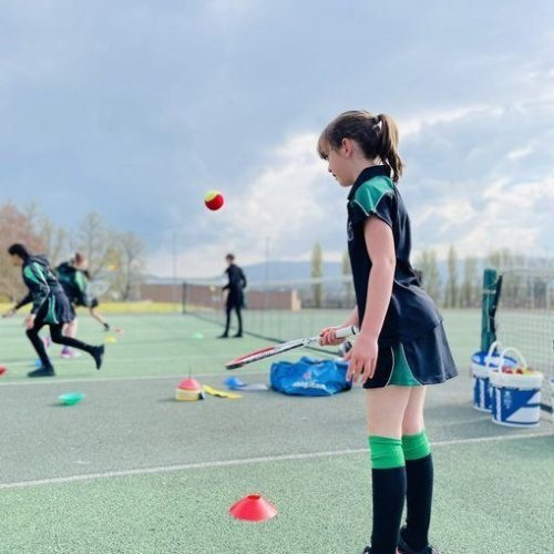 Myddelton summer schools in Liverpool student is playing tennis.