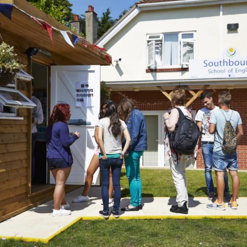 The building of Southbourne Summer Schools in Bournemouth and students.