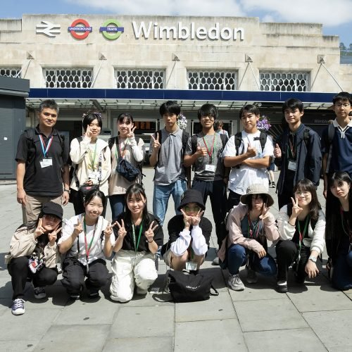 Students from Wimbledon Summer School in London are in front of Wimbledon station